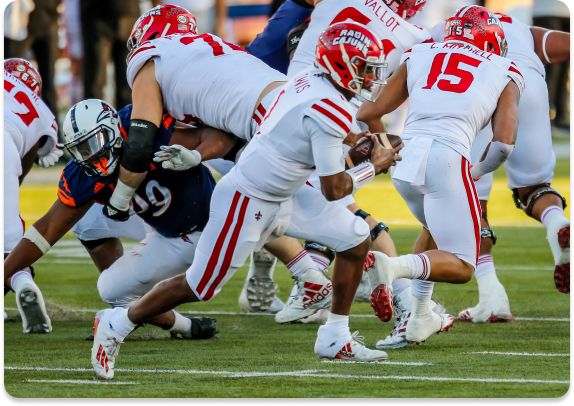 Ragin Cajuns quarterback Levi Lewis (1) runs through the line of scrimmage.