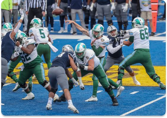 Quarterback Michael Pratt #7 of the Tulane Green Wave steps into the pocket to deliver a pass