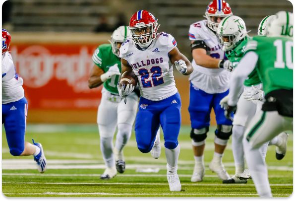 Louisiana Tech Bulldogs running back Israel Tucker (22) runs through the line of scrimmage