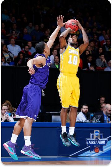 Southern University Jaguars shoots against the Holy Cross Crusaders.