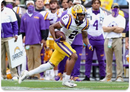 Koy Moore #2 of the LSU Tigers rushes with the ball